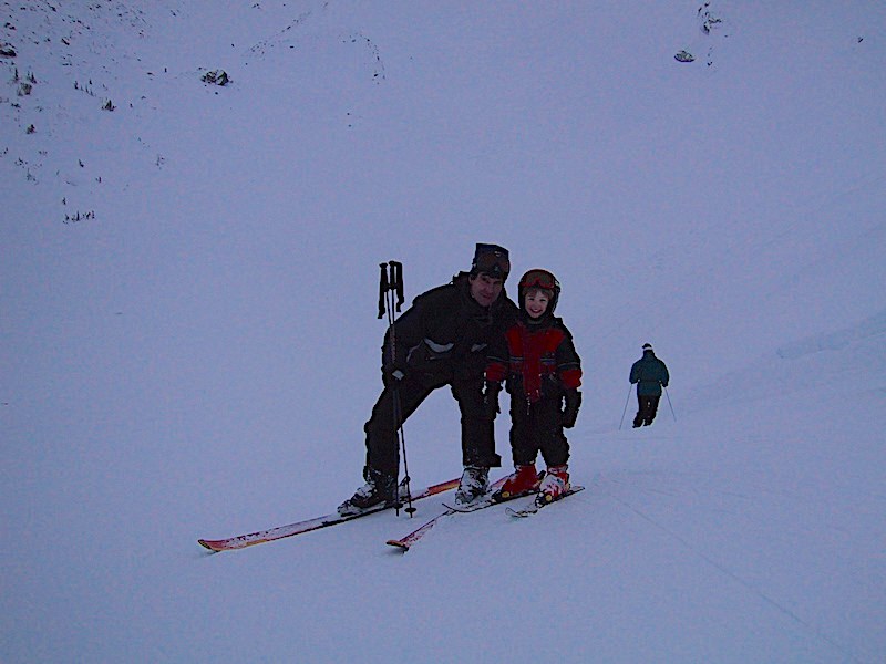 Larry, teaching his son Mitchell to ski in Whistler.